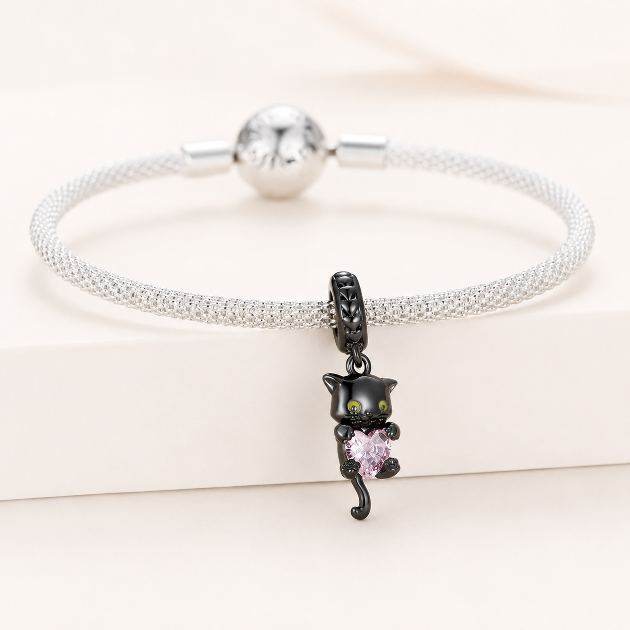 925 sterling silver black cat  charm holding a pink heart crystal | Asttery