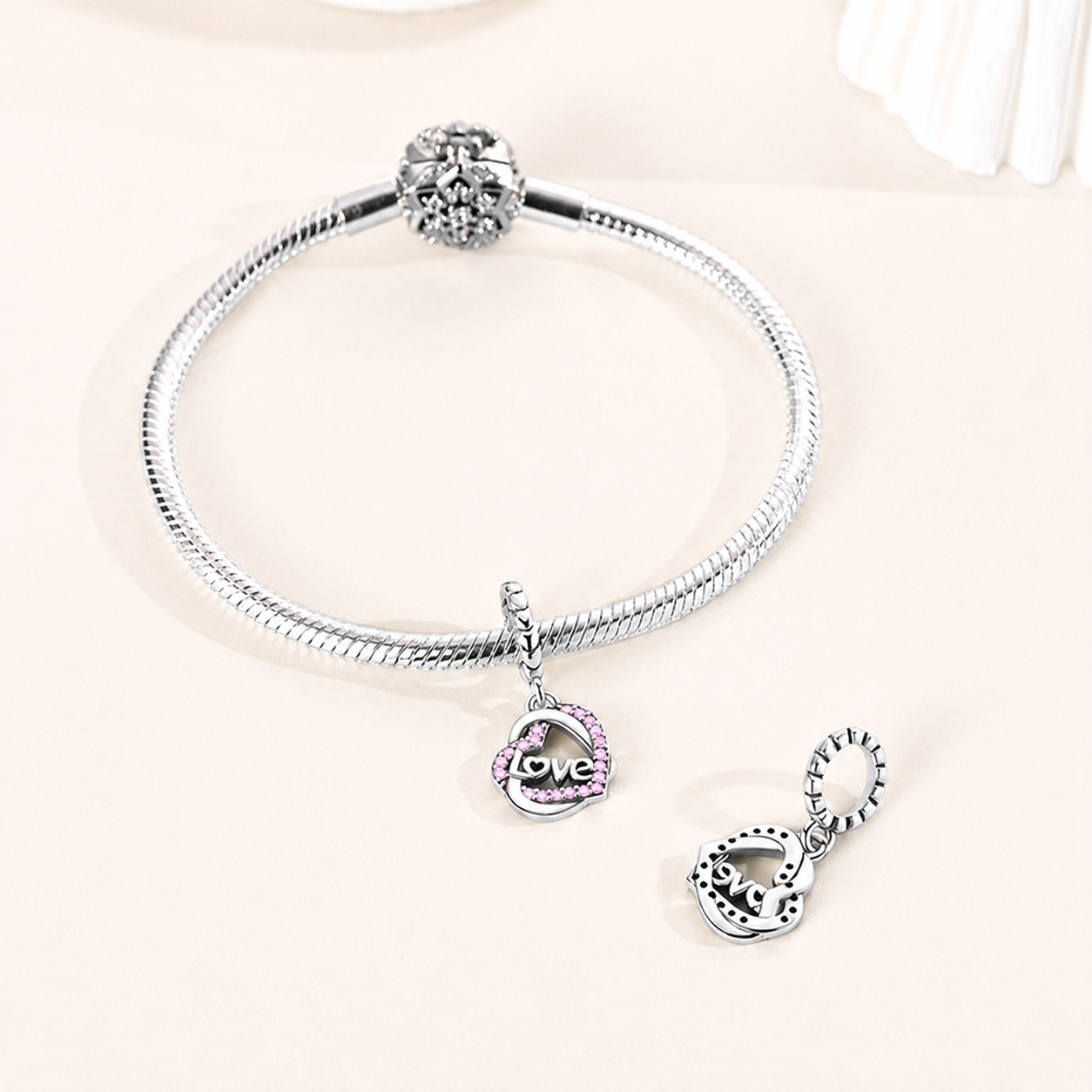 Aira love heart dangle charm styled on a silver bracelet, symbolising romance and emotional connection |Asttery
