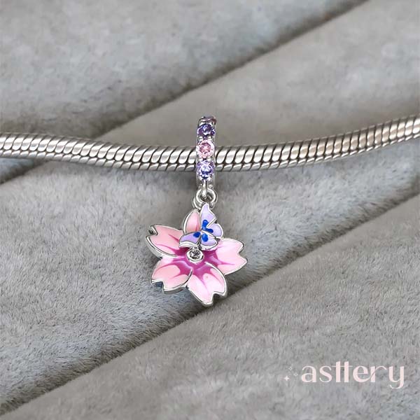 Alurelle charm on bracelet, symbol of beauty, blooming and delicate transformation | Asttery
