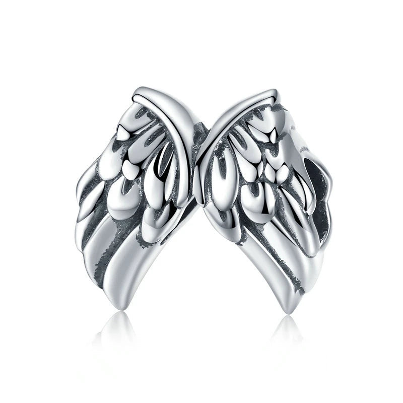 Alarune charm in 925 sterling silver with mirrored wing design and sculpted relief details | Asttery