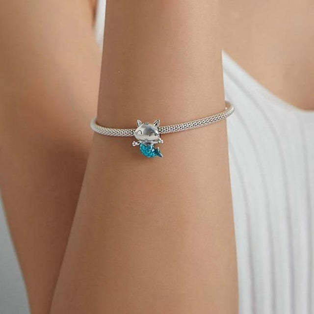 Aquelyn charm on bracelet, symbol of joy, imagination and gentle magic | Asttery