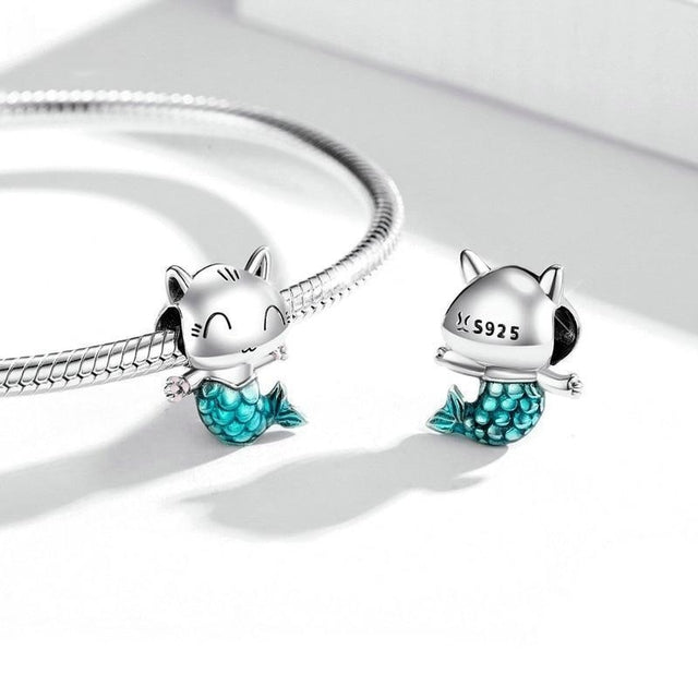 Whimsical silver charm featuring a smiling cat with a shimmering mermaid tail | Asttery