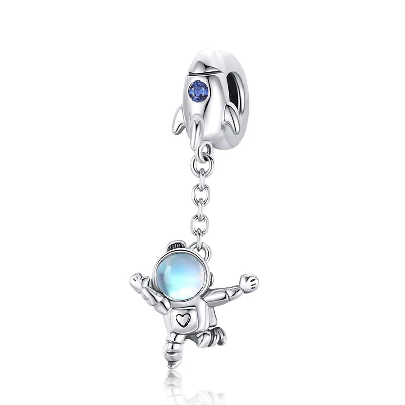 Orryon astronaut charm in 925 sterling silver with iridescent visor and blue rocket | Asttery