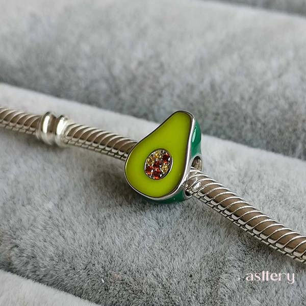 Playful avocado charm in sterling silver with warm-toned crystal accents |Asttery