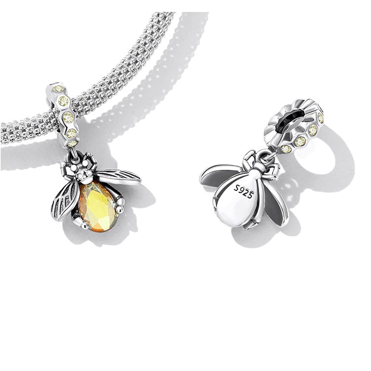 Sterling silver bee-shaped charm with bright yellow body and shimmering hoop  Asttery