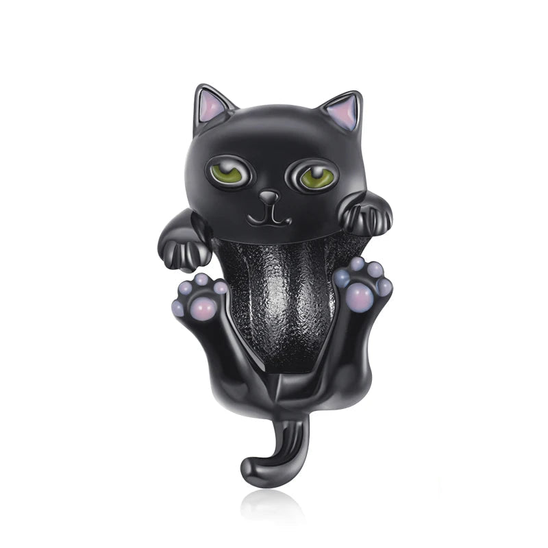 Noctelle black cat charm in 925 sterling silver with green eyes and pastel enamel details on paws, Asttery