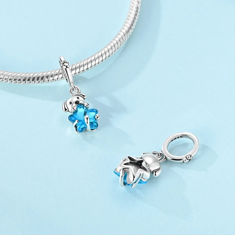 Top view showing the polished sterling silver puppy and bright blue glass star with detailed craftsmanship | Bluvi by Asttery