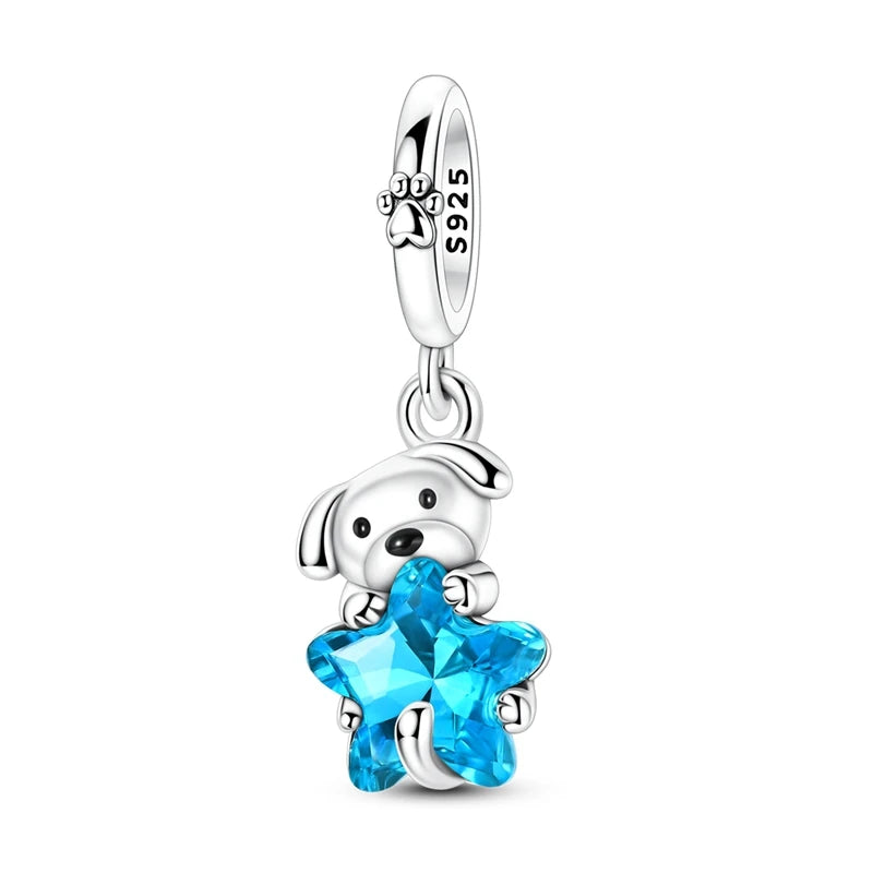 925 sterling silver dangle charm featuring a puppy holding a faceted blue glass star |  Bluvi by Asttery