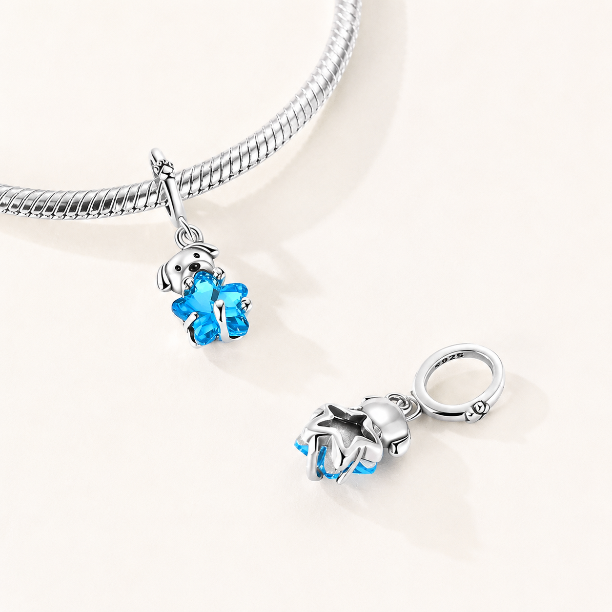 Top view showing the polished sterling silver puppy and bright blue glass star with detailed craftsmanship | Bluvi by Asttery