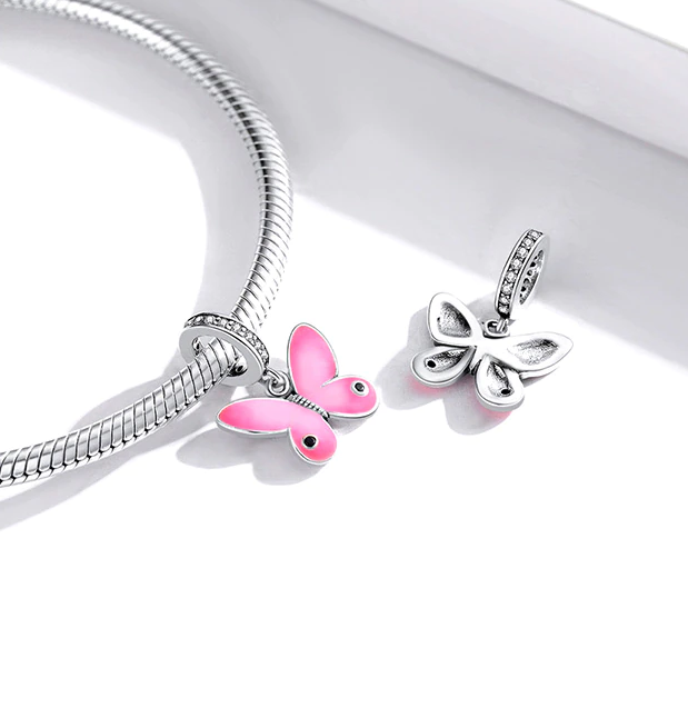 Lyselle butterfly charm on bracelet, symbol of renewal, softness, and poetic elegance,  Asttery
