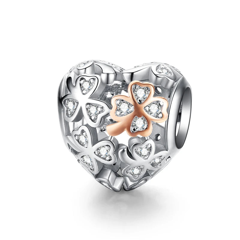 Silver heart charm with zirconia-studded clovers and rose-tone detail | Asttery