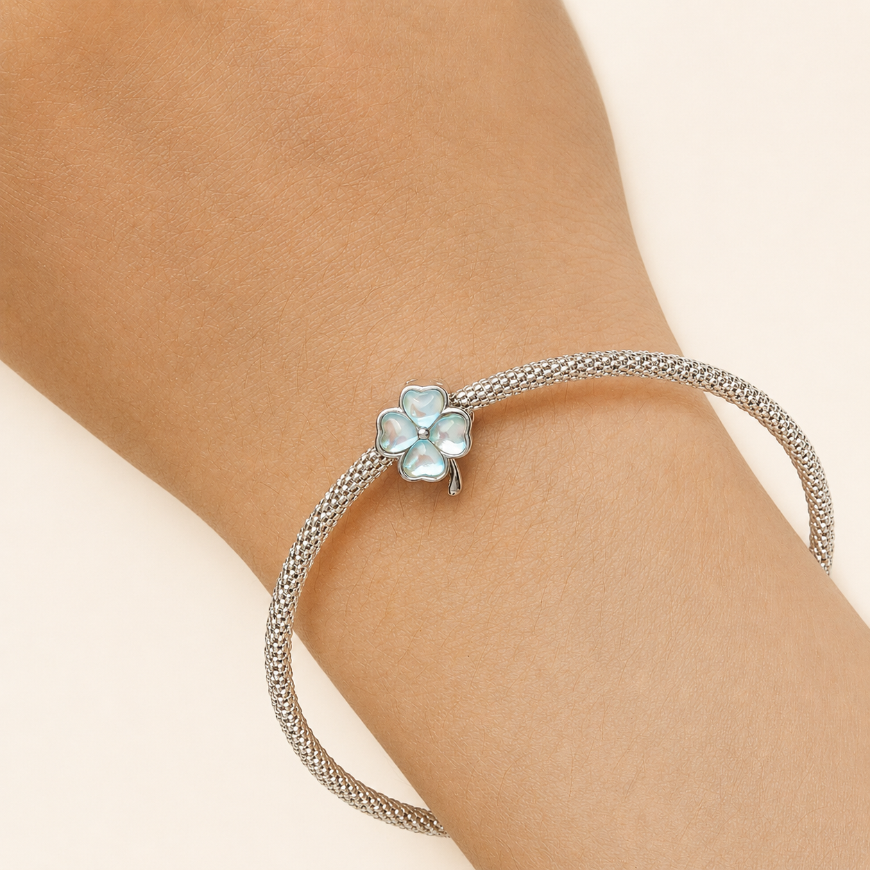925 Silver bracelet with a clover-shaped charm bead  on a wrist | Asttery