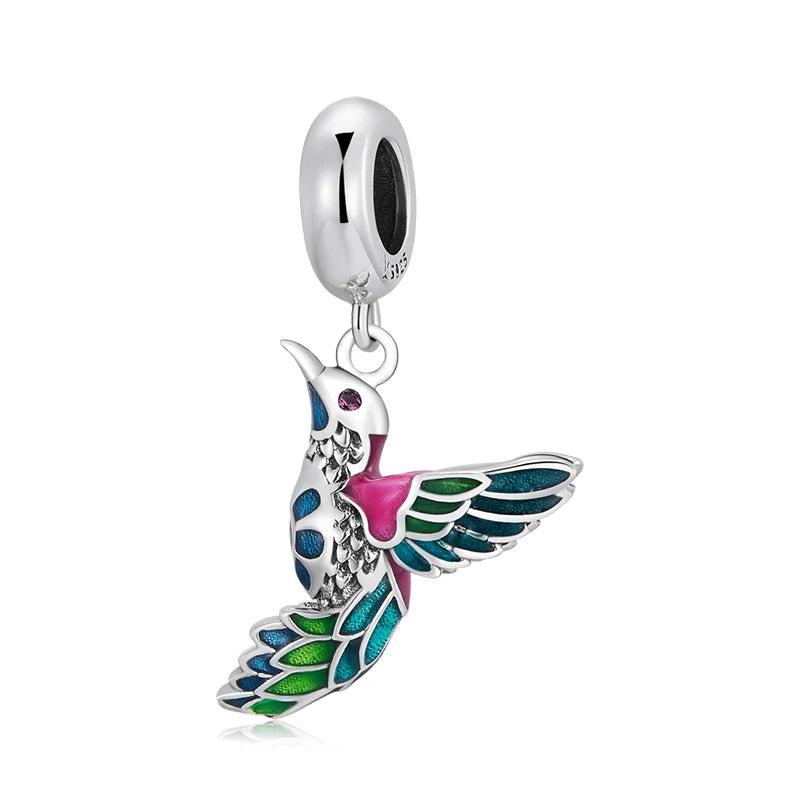 Alae bird charm in 925 silver with soft enamel in blue, green and pink | Asttery