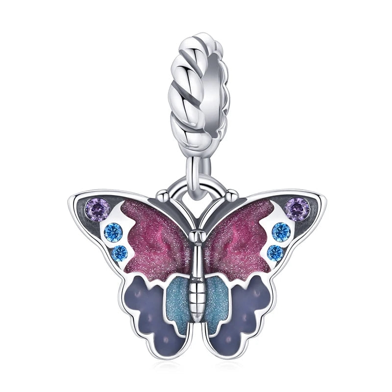 Butterfly charm Caliss in 925 sterling silver with pink and blue enamel and coloured zirconia stones | Asttery