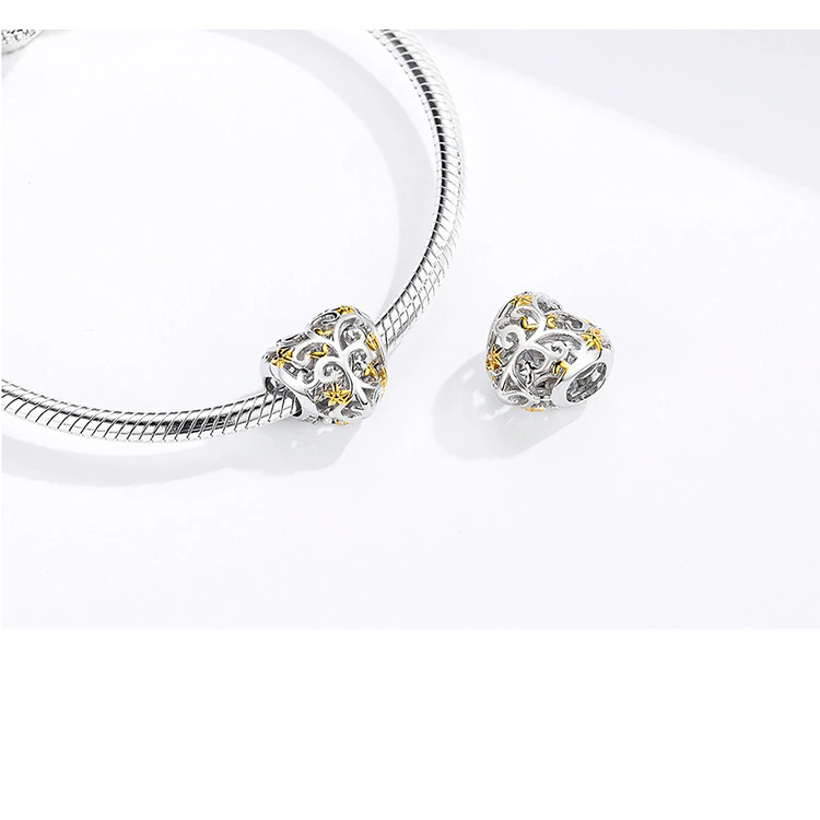 Heart-shaped sterling silver charm bead with openwork leaves and gold accents, crafted for European-style bracelets | Asttery