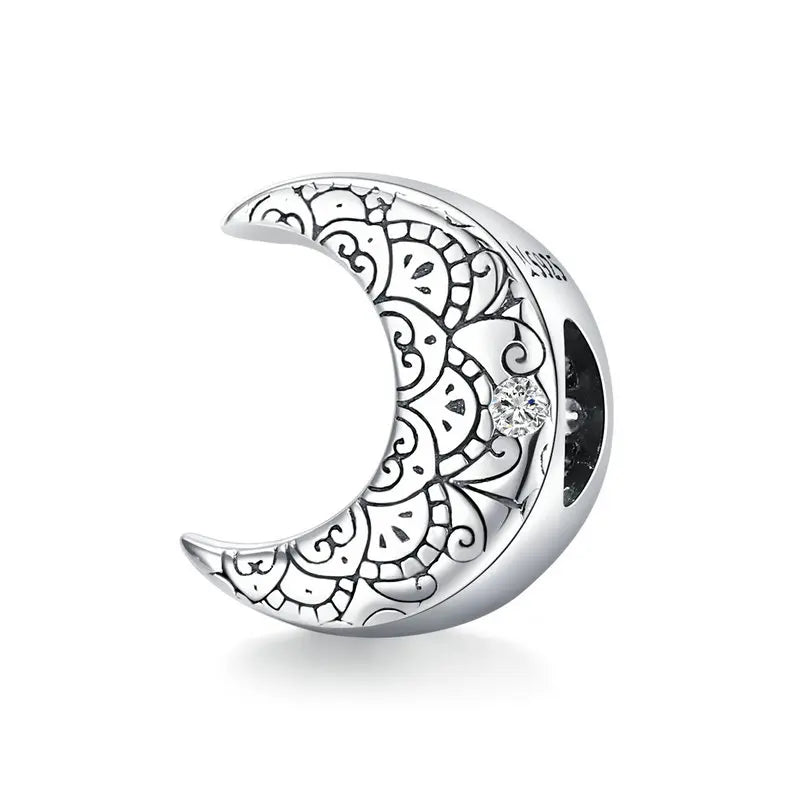 Lúnara crescent moon charm in 925 sterling silver with engraved detailing | Asttery