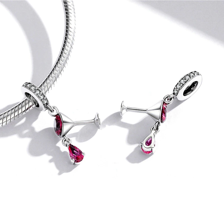 Crimelle charm worn on bracelet, symbolizing celebration, freedom, and radiant elegance, Asttery