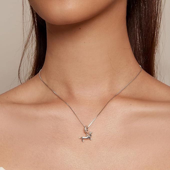Sterling silver dachshund charm with zircon-studded ring and elegant silhouette, Asttery