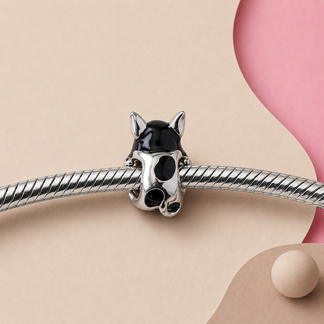 Sterling silver puppy charm bead showing black-and-white enamel | Asttery