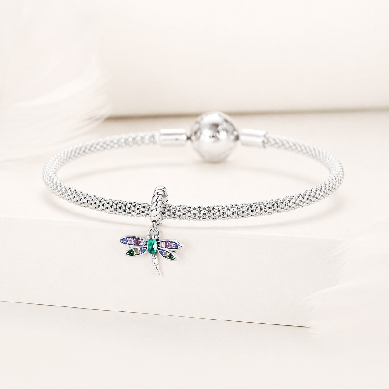 925 Silver Dragonfly dangle charm shown on a silver bracelet | Asttery