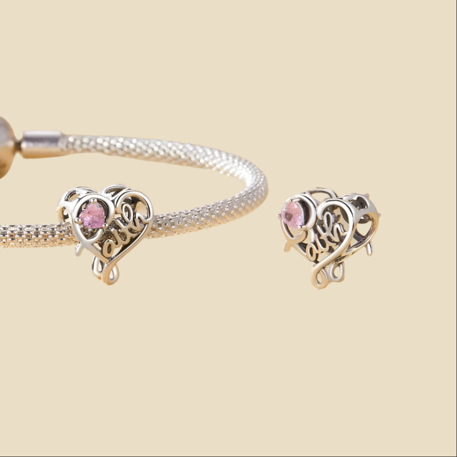 Open-heart silver charm with engraved “faith” and pink cubic zirconia | Asttery