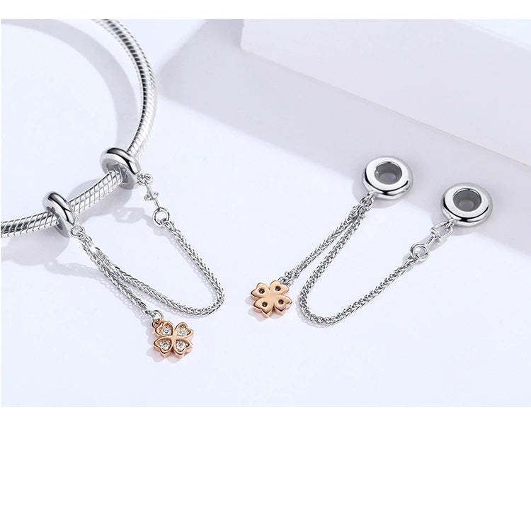 Elegant silver bracelet safety chain with lucky clover detail – Feyllin | Asttery