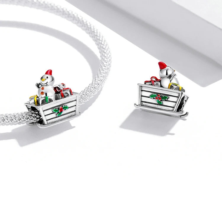 Flokim charm on a bracelet, symbolizing festive joy, lightness, and winter magic | Asttery