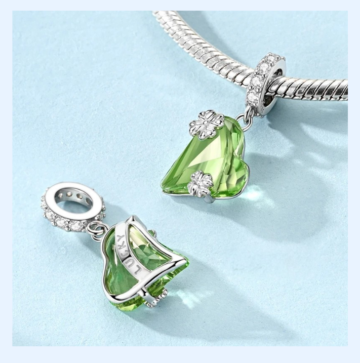 Verdiluni heart clover dangle charm styled on a silver bracelet | Asttery