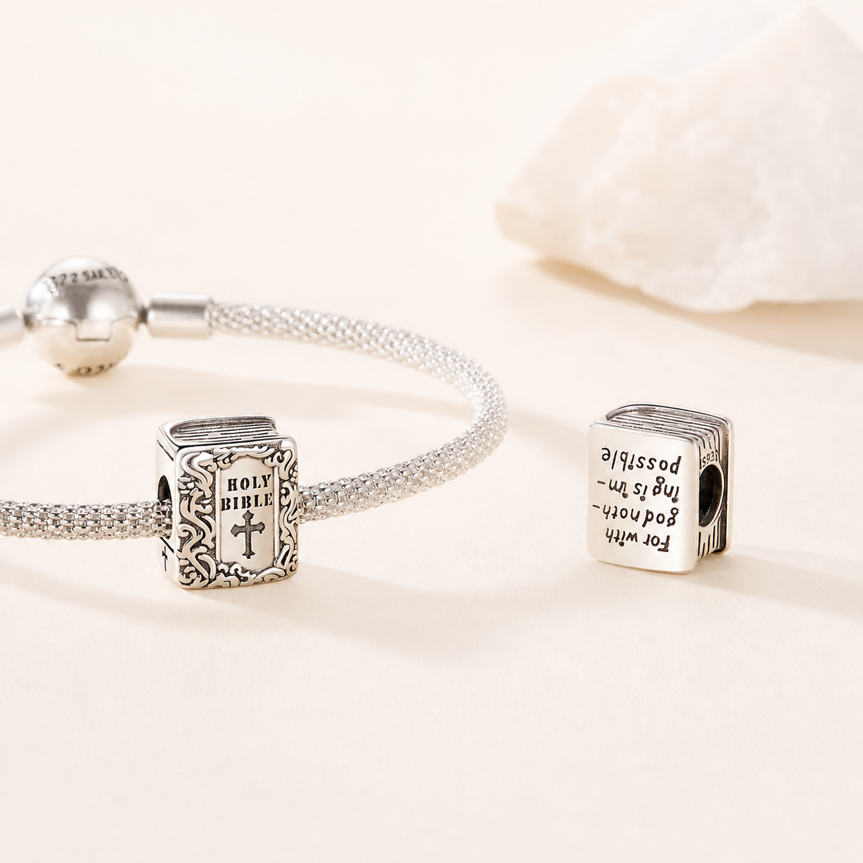 Holy Bible charm bead styled on a silver bracelet. Religious Charms | Asttery