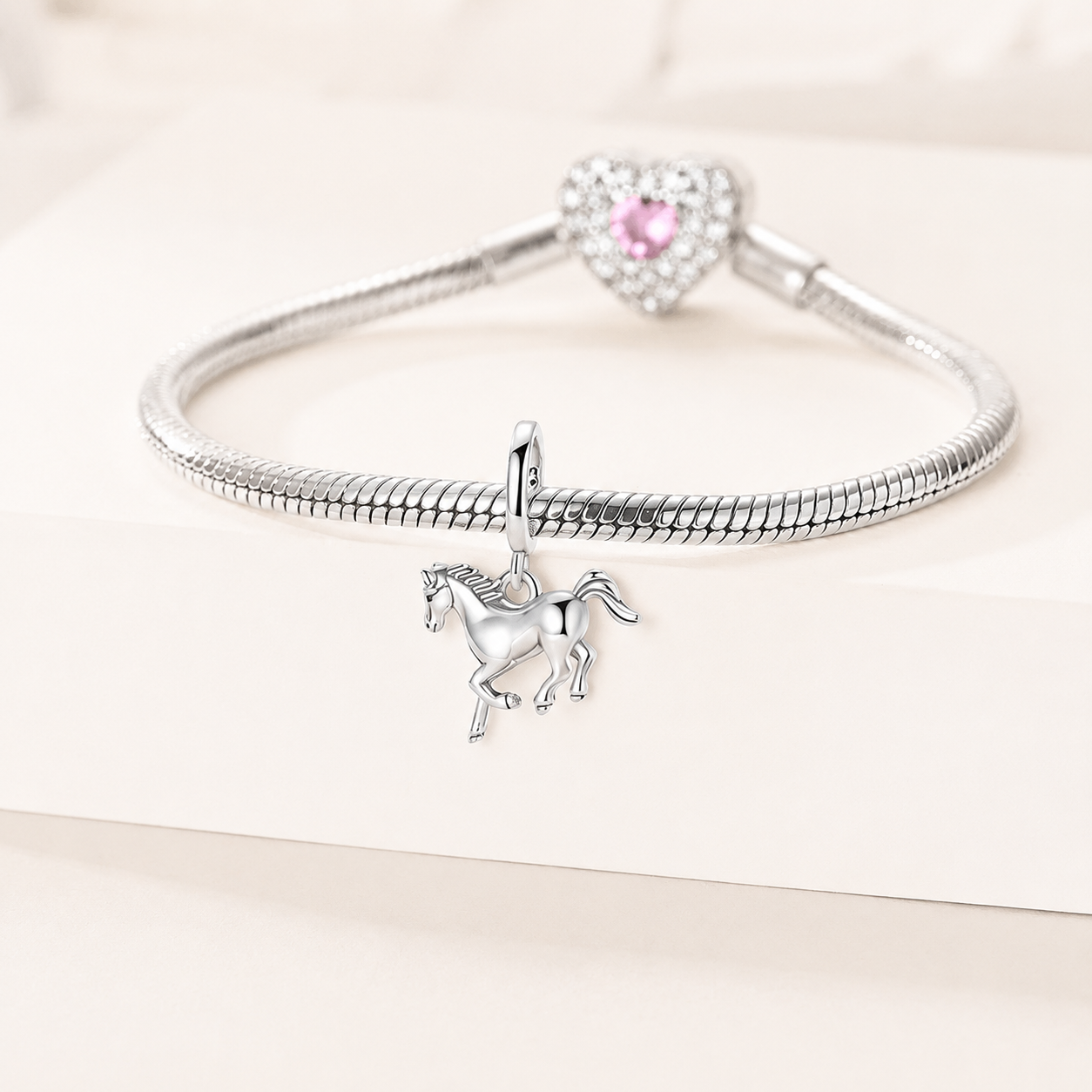925 silver horse charm styled on a silver bracelet | Asttery