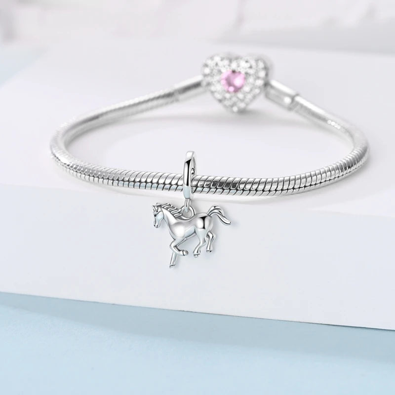 Horse charm styled on a silver bracelet  Asttery