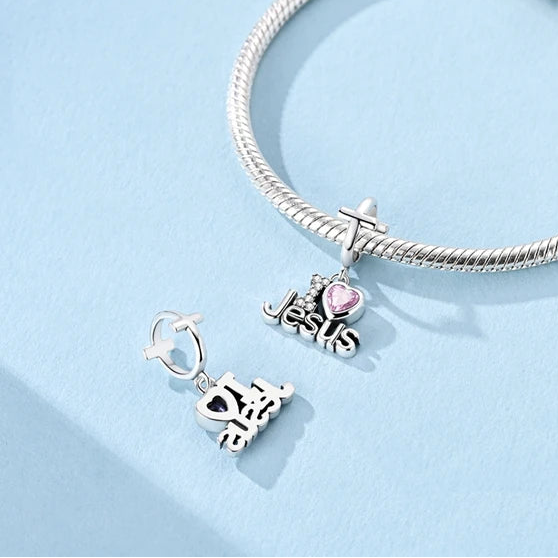 Front view of the Amoria Faith charm showing cross bail, ‘I Love Jesus’ lettering and sparkling cubic zirconia details | Asttery