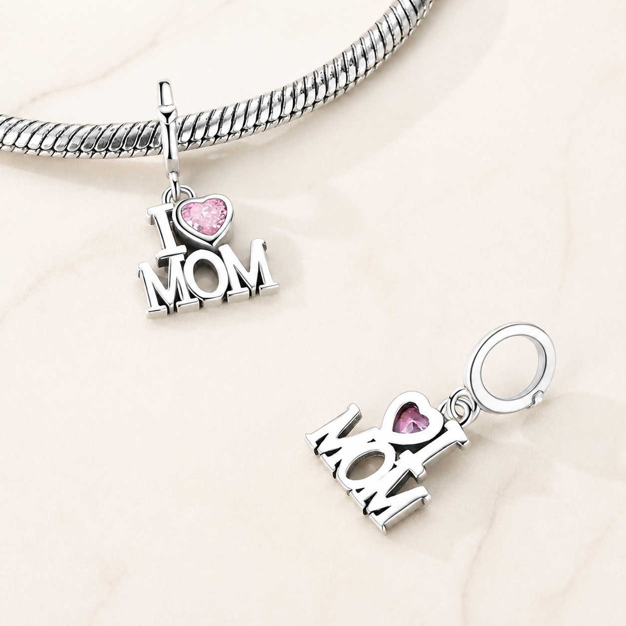 I love Mom charm with pink heart zirconia on bracelet symbolising love and gratitude | Asttery