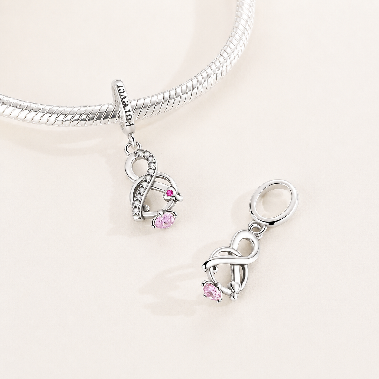925 sterling silver infinity knot dangle charm with clear and pink zirconia | Asttery