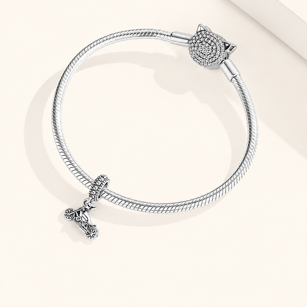 Kinetor charm on a bracelet, symbolizing freedom and continuous movement for those who follow their own path | Asttery
