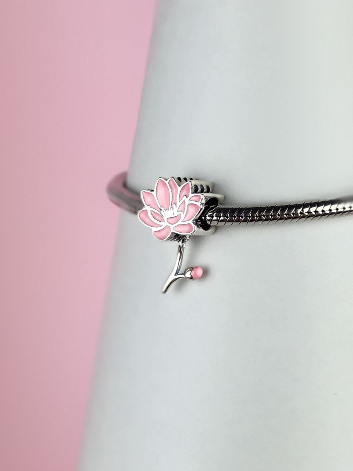 Lotis charm in sterling silver with blooming pink lotus design | Asttery