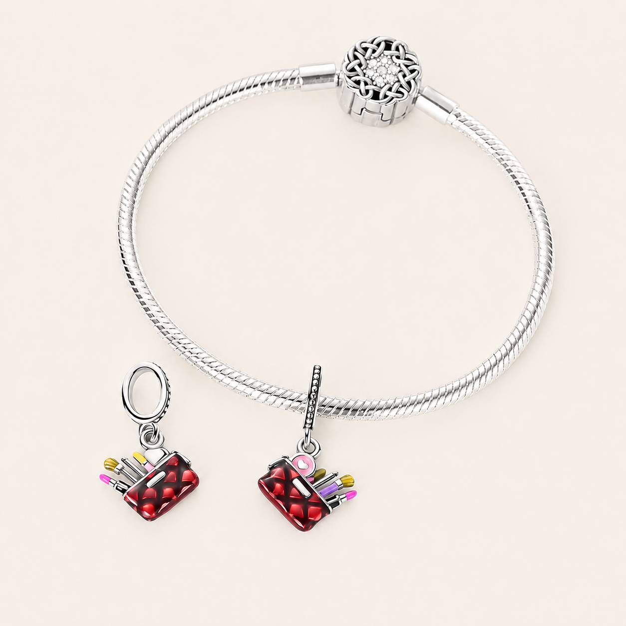 Makeup bag dangle charm shown on a silver bracelet 925 sterling silver | Asttery
