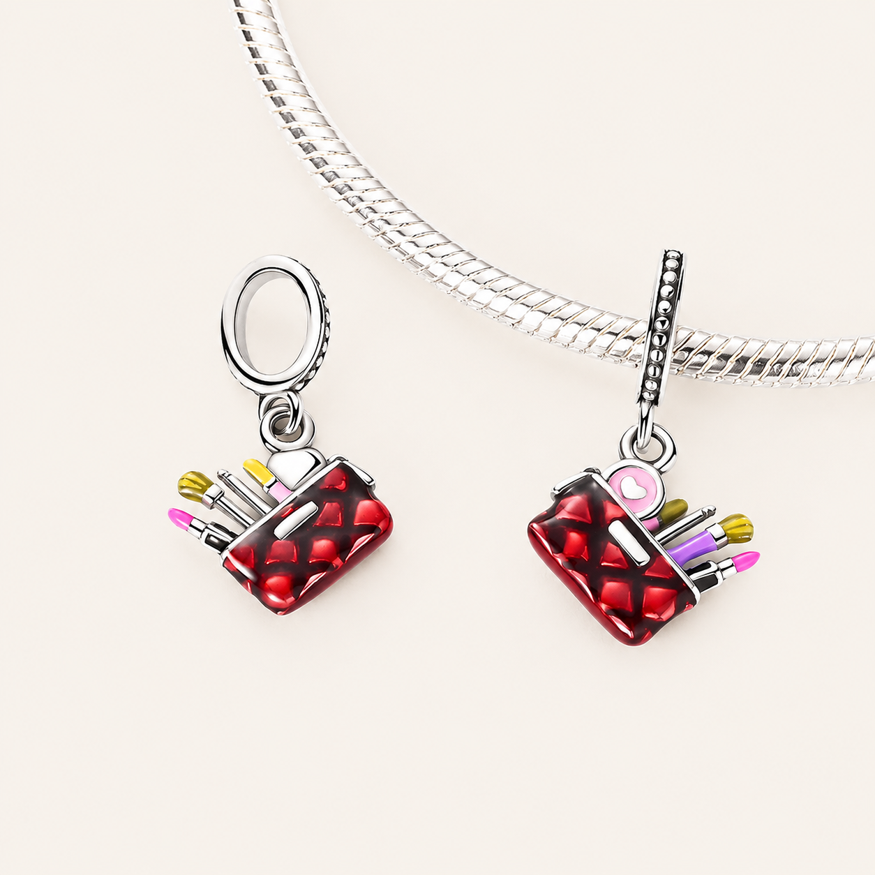 925 sterling silver makeup bag dangle charm shining in red and gold tones, symbolising beauty and self-care | Asttery