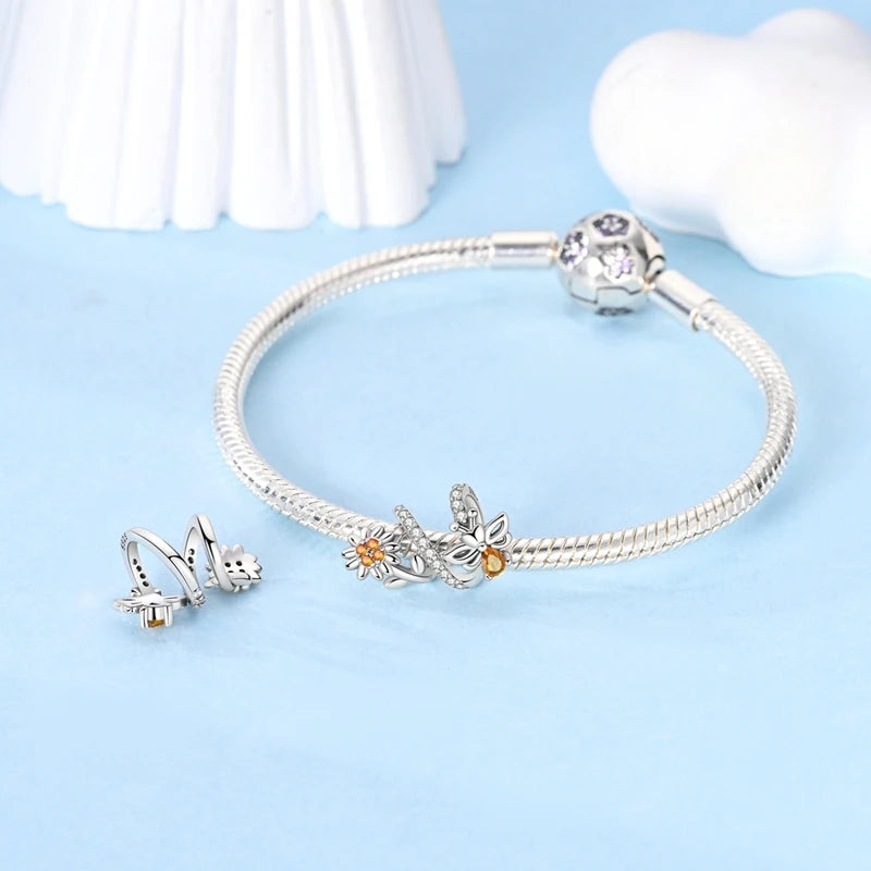 Mellis bee charm styled on a silver bracelet | Asttery