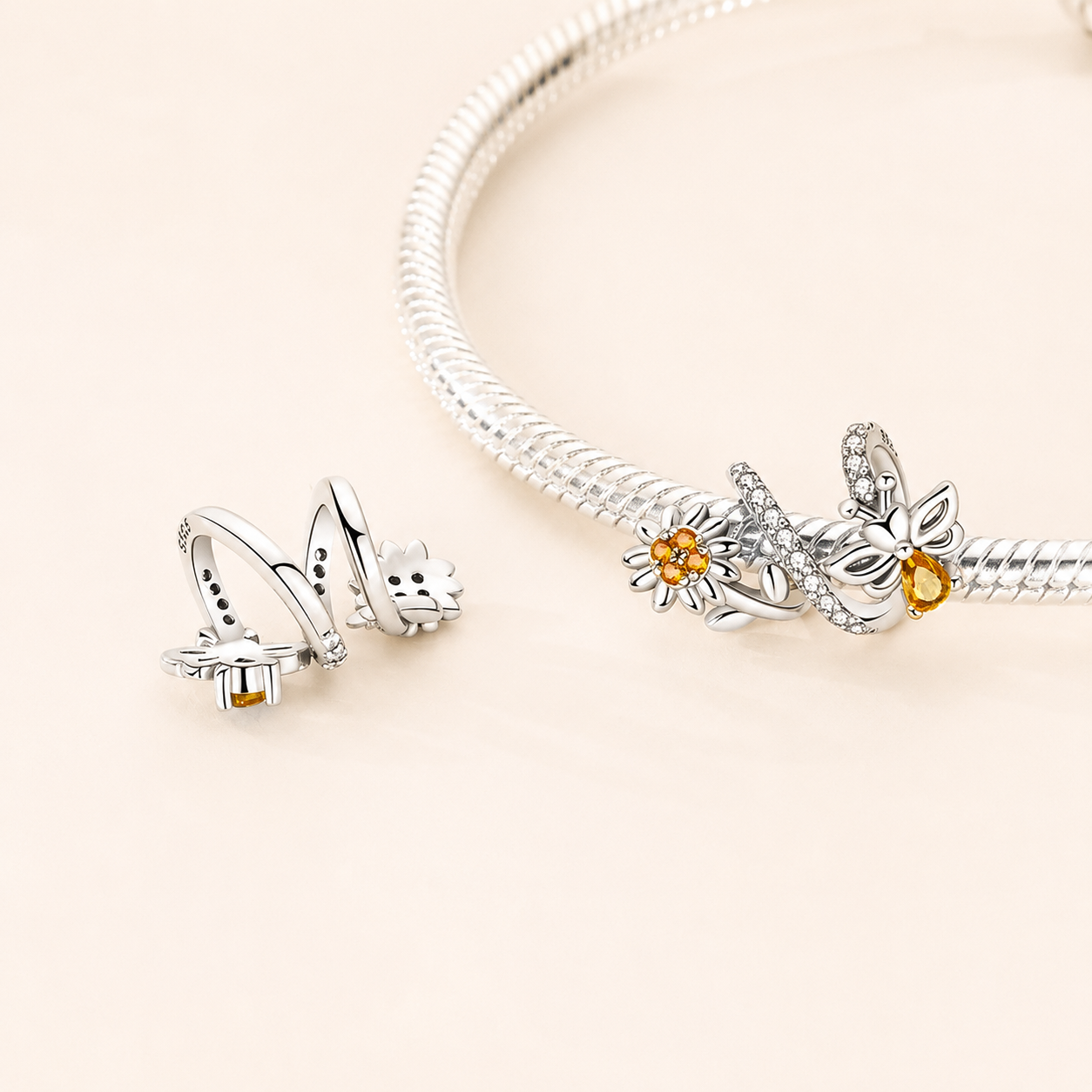 Front view of the Mellis charm bead showing the bee and floral design with zirconia accents | Asttery