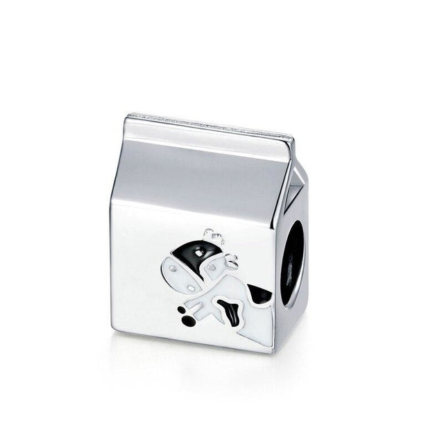 Milun charm in 925 sterling silver shaped like a milk carton with enamel cow detail | Asttery
