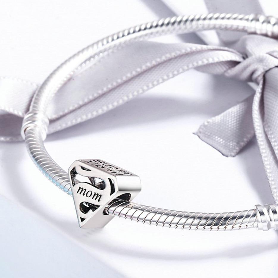 Side view of the sterling silver Mom emblem bead showing the sculpted shield shape | Asttery