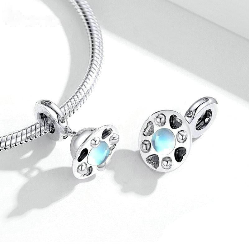 Spaceship-shaped charm with polished dome and celestial details | Asttery