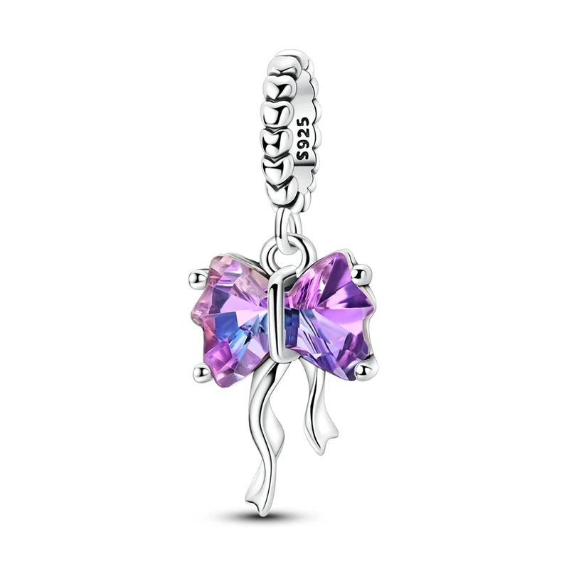 925 sterling silver Ametys Bow dangle charm with faceted purple cubic zirconia and flowing ribbon details | Asttery