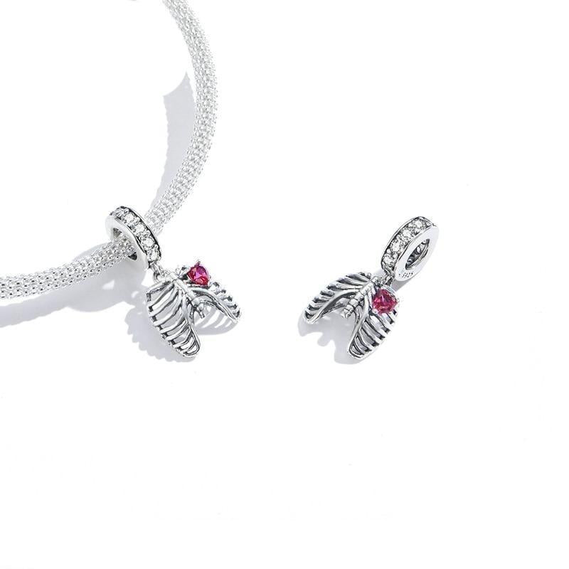 Anatomical silver charm with heart detail in soft pink zirconia | Asttery