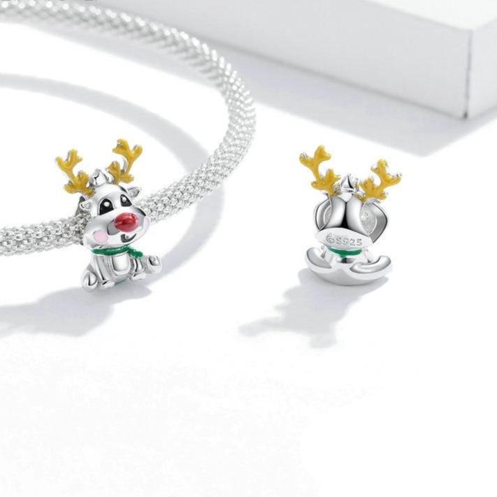 Whimsical reindeer charm with red nose, green scarf, and golden antlers | Asttery