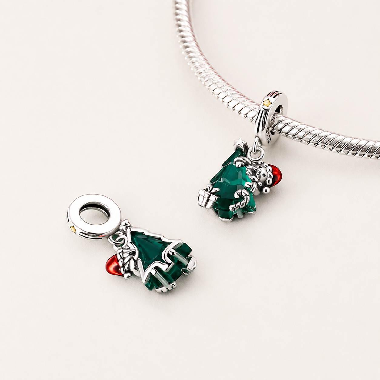 Front and back view of 925 sterling silver Santa’s Embrace dangle charm shining on bracelet, symbolizing the warmth and joy of Christmas memories | Asttery