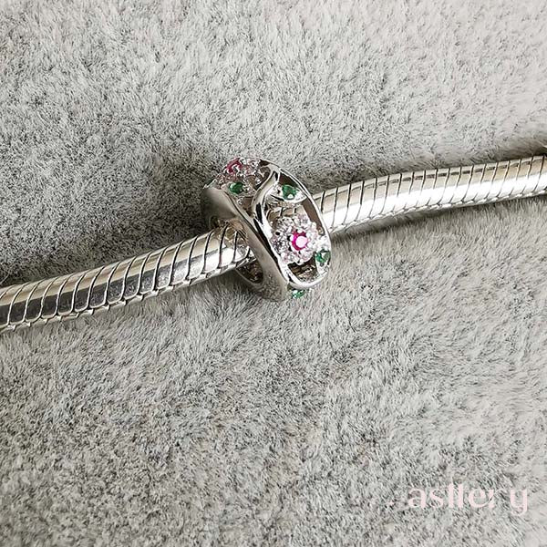 Elegant floral spacer charm Fiora with cubic zirconias in soft tones | Asttery