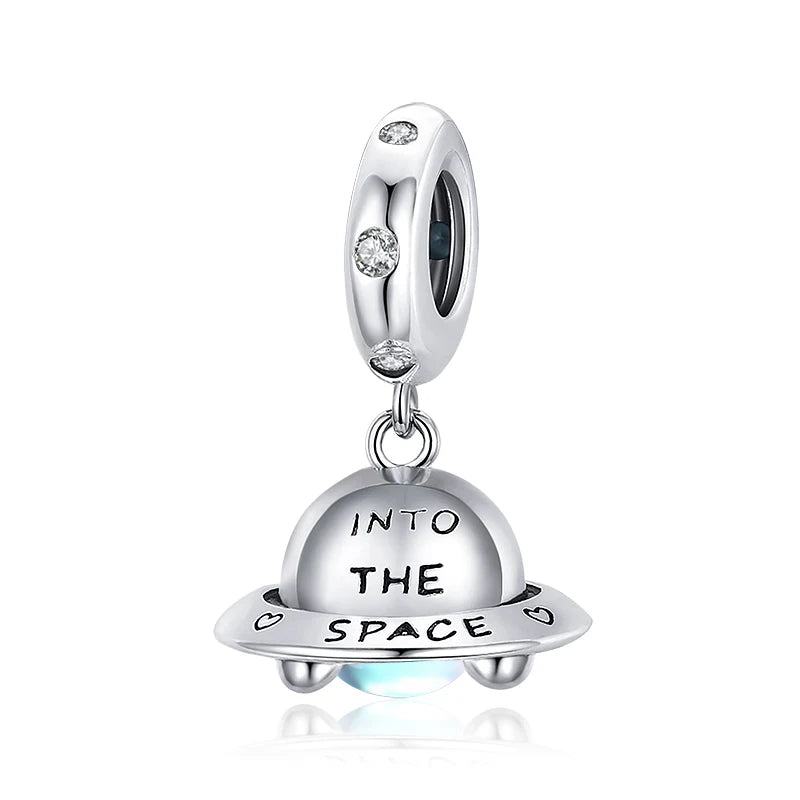 Sterling silver spaceship charm Nébulis with engraved phrase “Into the space” | Asttery