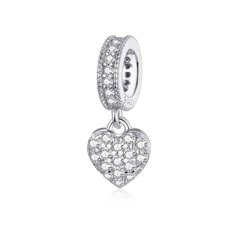 Dangling heart charm in 925 sterling silver with pavé zirconia | Asttery